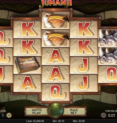 Foto de ação de um jogador participando do jogo de slot Jumanji, no meio do giro com recursos de bônus ativados.